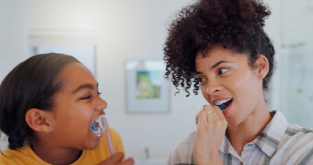 Hygiene, bathroom and mother brushing teeth with child for oral health and wellness at home....