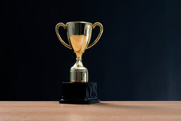 Golden trophy cup on the table