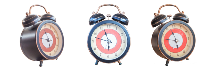 An antique clock placed on a wooden table