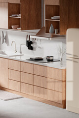 A bright beige-toned kitchen interior with sunlight 
coming through the window.