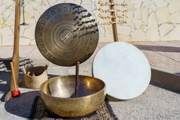 different percussion instruments for sound baths or sonotherapy in a street market, tibetan bowl,...