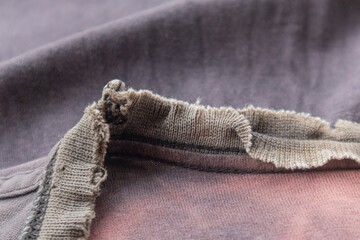 The frayed collar of an old T-shirt.
