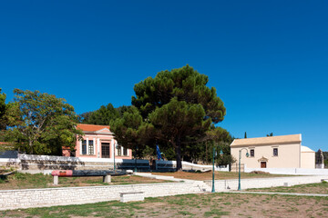 The plaza with the school and church in Ereikoussa island, Greece