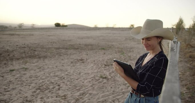 Woman, ranch or farm on tablet, nature and thinking with typing, agriculture and mockup space. Cowgirl, farmer or person with digital touchscreen, click and reading on app for sustainability in Texas