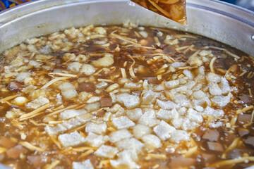 Thai style of Braised fish maw with pork rind in the large pot