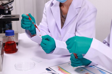 Researcher hand holding a blood vessel Vascular examination in a research laboratory Medical...