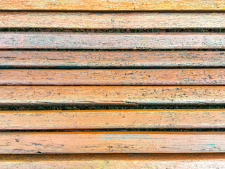 Yellow wooden boards on a bench as an abstract background. Texture