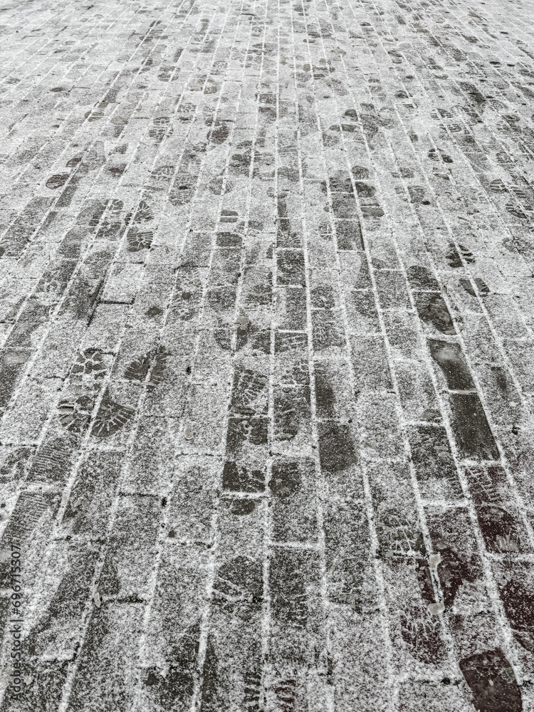 Wall mural Paving slabs covered with snow. Background