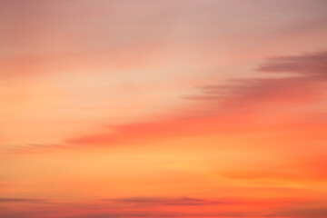 Fototapeta premium A beautiful sky tinted by the sun leaving vibrant shades of gold, pink, blue and multicolored. Clouds in the twilight evening and morning sky. Image of a cloudy sky in the evening and during the day