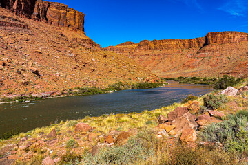 Fototapeta na wymiar The Colorado River runs through a canyon near Moab Utah