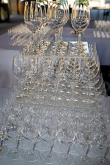 table with pyramid of wine and champagne alcohol glass ready for cocktails at a party event