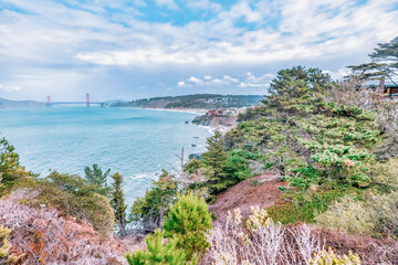 Distant view of the Golden Gate Bridge taken near Land's End Trail, San Francisco, California, USA