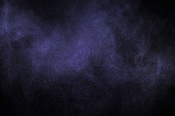 Purple explosion on black background. Light violet dust texture. 
