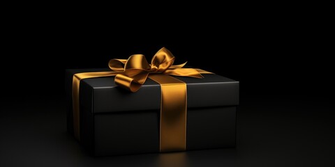 A black gift box with a gold ribbon, perfect for any special occasion or celebration