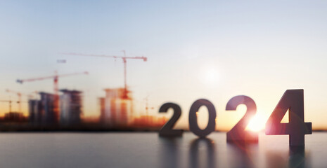 Brightly rising new year in 2024, sunrise, architecture and construction site background, and building and apartment real estate market concept
 - obrazy, fototapety, plakaty