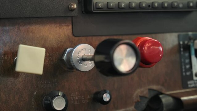 Throttle Lever in Small Airplane Cockpit in Flight, Close Up Panel
