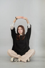 This thoughtful teen's black hoodie is an ideal backdrop for printing, ready to be personalized...