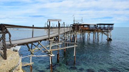 Fototapeta na wymiar Fishing platforms on the Italian coast called trabocchi transformed into restaurants