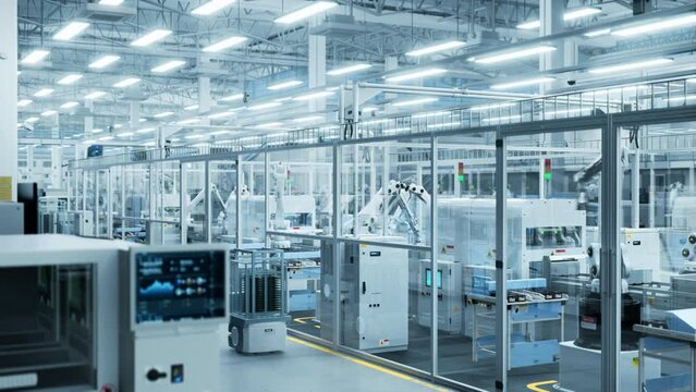 Aerial Footage with Electronics Factory 3D Concept. Automated Robotic Arm Assembly Line Manufacturing Advanced High-Tech Components. Industrial Production Conveyor Line Monitored by AI Mobility Robots