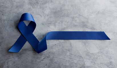 Prostate Cancer Awareness Campaign Concept. Men Healthcare. Close up of a Blue Ribbon  Lying on...