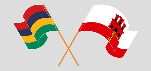 Crossed and waving flags of Mauritius and Gibraltar