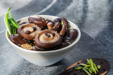 marinated shiitake. canned shiitake on a plate close-up