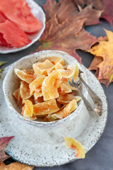 Homemade watermelon rind candy. Dessert from watermelon rinds in handmade earthenware