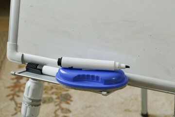 close-up erasable blackboard eraser and pen,