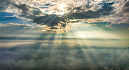 Aerial view of Saigon cityscape at morning with misty sun rays sky in Southern Vietnam. Urban...