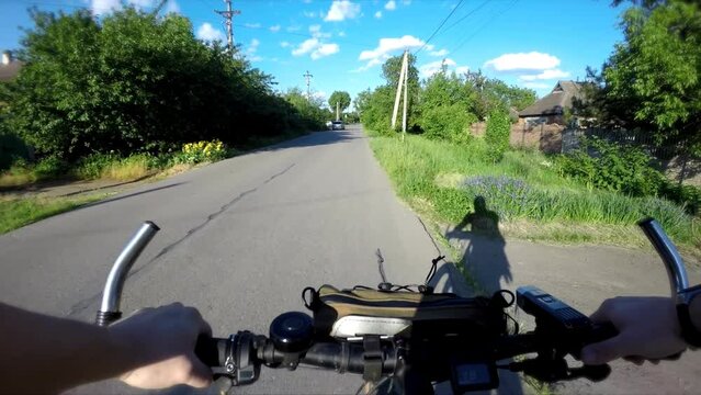 Bike POV. Cycling Through Nature's Beauty. Electric Bike Adventure. First-Person View of a Thrilling E-Bike Ride. Exploring Nature on an Electric Bicycle.