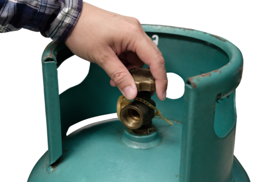 Male hand is closing the valve of lpg gas tank for safety. Files can use clipping parts.