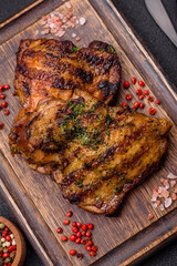 Delicious juicy beef or chicken steak with salt, spices and herbs