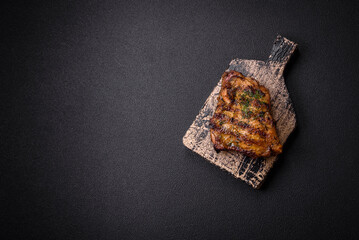 Delicious juicy beef or chicken steak with salt, spices and herbs