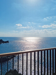 Jeju sea and railings illuminated by sunlight
