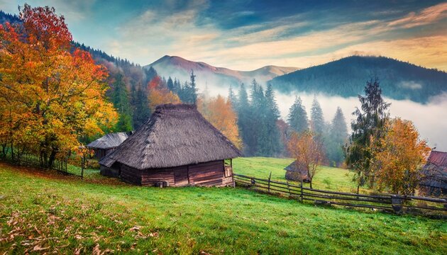 foggy autumn scene of mountain willage with old wooden house in garden calm morning view of carpathian mountains ukraine europe beauty of countryside concept background