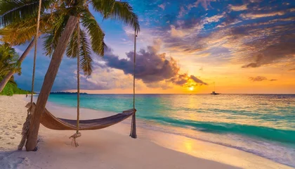 Wandaufkleber tropical sunset beach and sky background as exotic summer landscape with beach swing or hammock and white sand and calm sea beach banner paradise island beach vacation or summer holiday destination © Bryson
