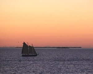 Sailing ship on a Caribbean ocean at sunset