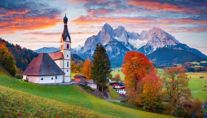 iconic picture of bavaria with maria gern church with hochkalter peak on background fantastic autumn sunrise in alps superb evening landscape of germany countryside traveling concept background