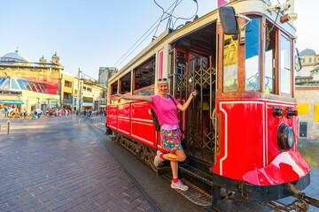 touristic tram ride in Istanbul's Kabatas district, a captivating visual odyssey that encapsulates the vivid transformation of this bustling Turkish urban landscape in Istanbul, Turkey.