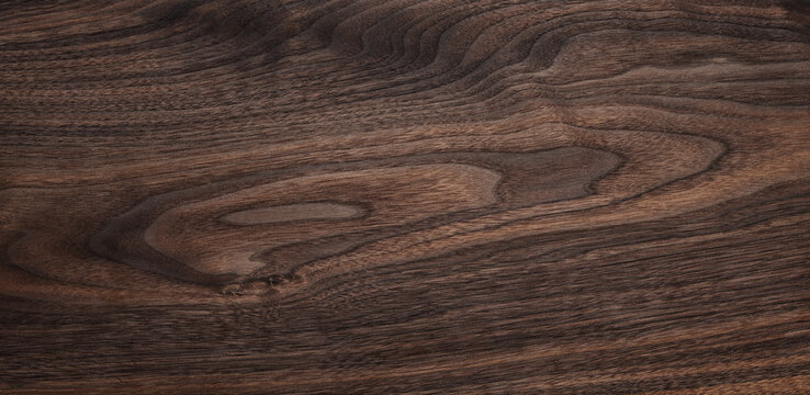 Walnut texture background. Dark wooden plank desktop texture background.