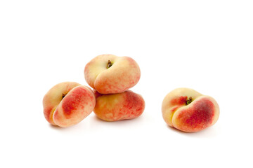 Several saturn peaches or flat peaches isolated on white background with clipping path..