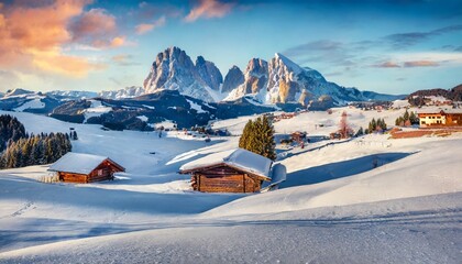 christmas postcard bright winter view of alpe di siusi village with plattkofel peak on background incredible morning scene of dolomite alps spectacular winter landscape of ityaly europe