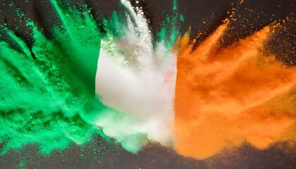 colorful irish tricolour flag in green white orange color holi paint powder explosion isolated background ireland europe celebration soccer fans travel tourism concept - obrazy, fototapety, plakaty