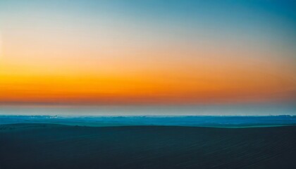 Fototapeta na wymiar minimalistic sunset landscape orange sky and blue ground