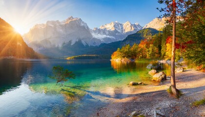 impressive summer sunrise on eibsee lake with zugspitze mountain range sunny outdoor scene in german alps bavaria germany europe beauty of nature concept background - obrazy, fototapety, plakaty