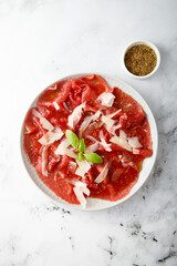 Traditional beef carpaccio with parmesan cheese