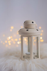 Christmas lantern with bokeh lights on white background. Festive decoration.