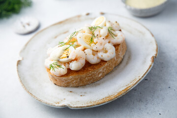 Traditional Scandinavian shrimp sandwich with egg and dill