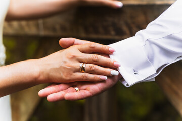 Detail of hands of bride and groom with rings at a wedding, marriage ceremony