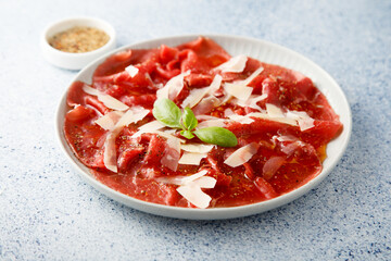 Traditional beef carpaccio with parmesan cheese